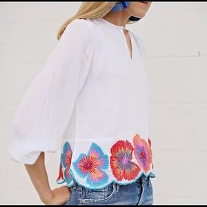 White blouse with colorful floral pattern